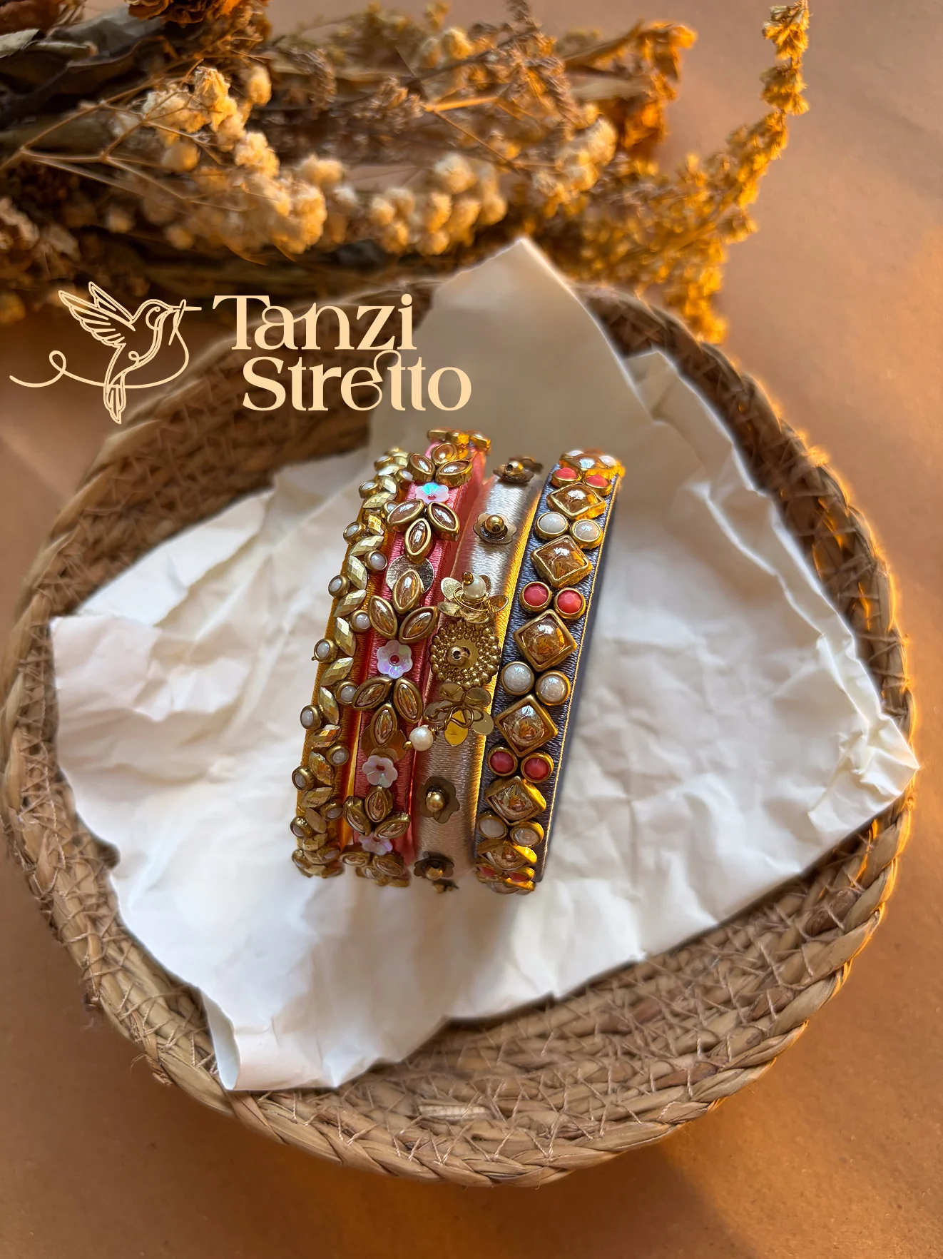 Roddur bangle set resting in a woven basket