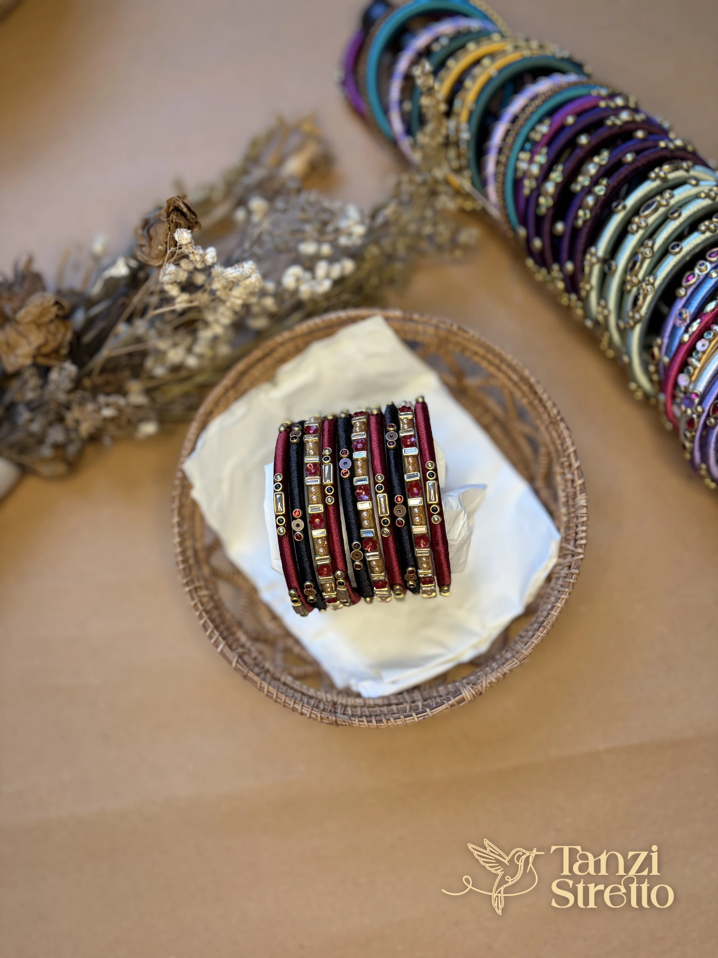 Anonya 2.0 bangle stack in a basket on kraft paper