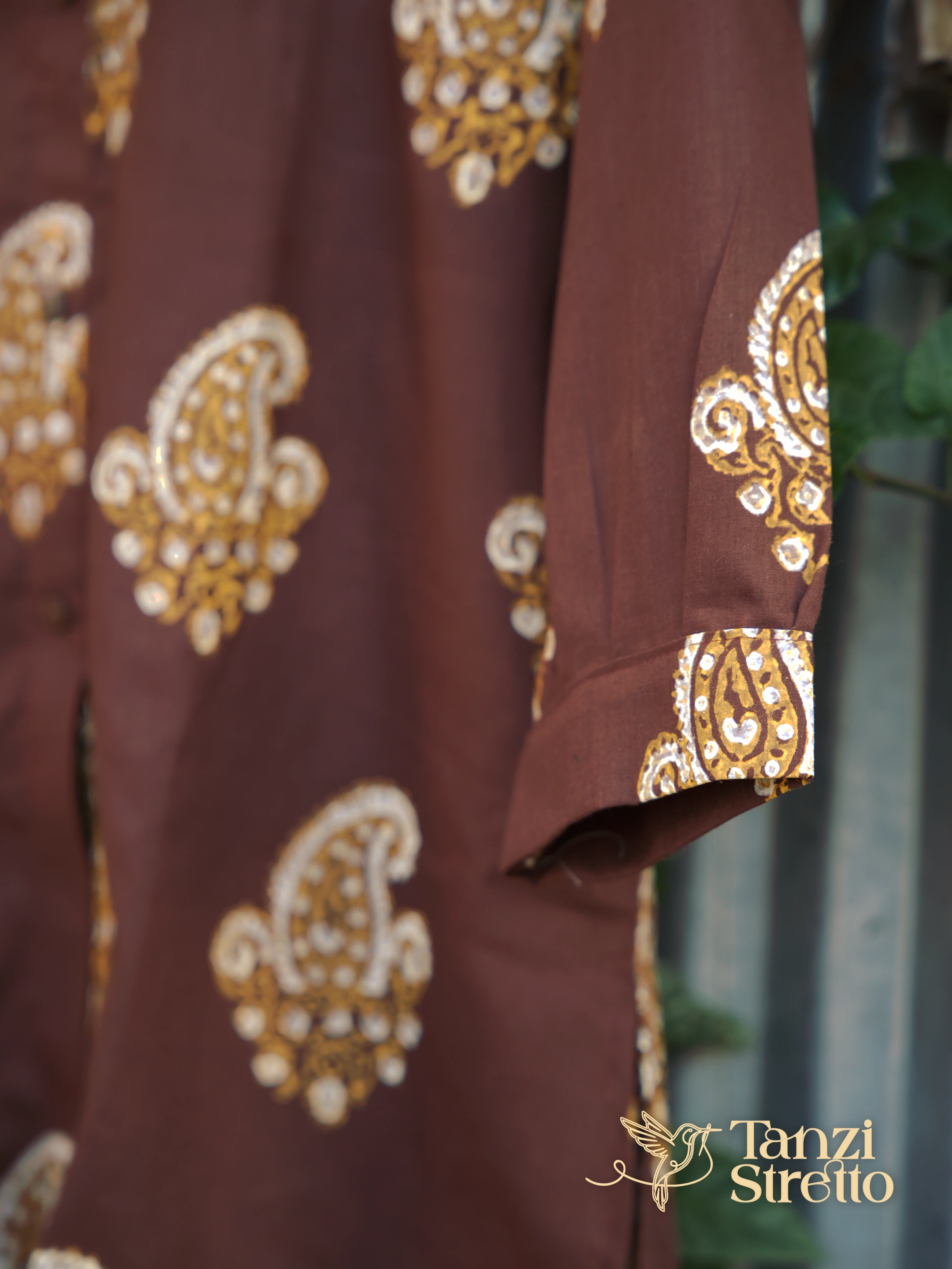 Milind gathered sleeve cuff with a paisley at the wrist